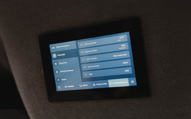 Control panel of the HYMER Smart Connect Unit installed in the wall of a camper van